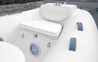 GRAND Golden line luxury fiberglass bow seat & locker, bow step plate, and cushions for luxury rigid inflatable boat (RIB) tender.