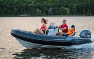 GRAND Golden line 13’9″ long luxury tender; rigid inflatable boat (RIB) with fiberglass hull, steering console, seating, handrails, bow step plate and outboard motor.