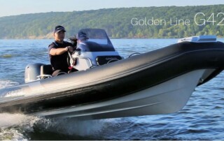 Boating front view of GRAND golden line luxury rigid inflatable boat (RIB) tender in black, 13’9″ long.
