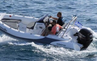 Boating in a GRAND golden line 16’3″ long luxury rigid inflatable boat (RIB) in white & gray with a fiberglass hull.