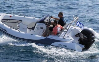 Boating in a GRAND golden line 16’3″ long luxury rigid inflatable boat (RIB) in white & gray with a fiberglass hull.