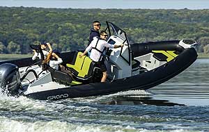 GRAND DRIVE ACTIVE 20′ 1” fiberglass rigid inflatable boat (RIB) equipped with steering console, windshield, handrails, swim platforms, and towing/navigation arch.